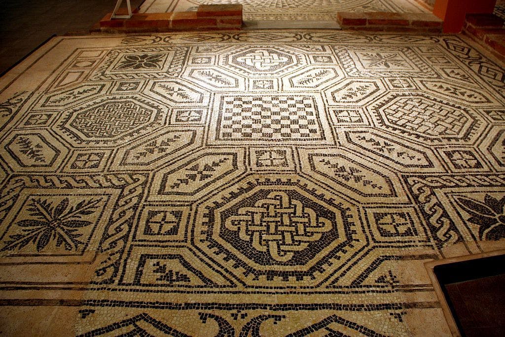 Mosaic inside the Museum Civico Archeologico (by G.dallorto, Attribution, via Wikimedia Commons)